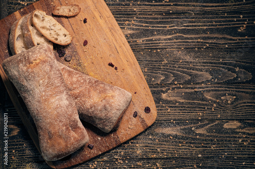 delicious white ciabatta slices on wood;