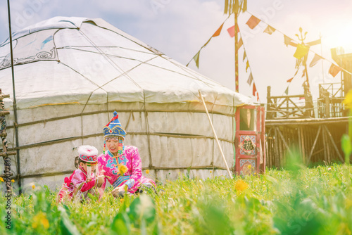 Mother and daughter playing in front of the yurt