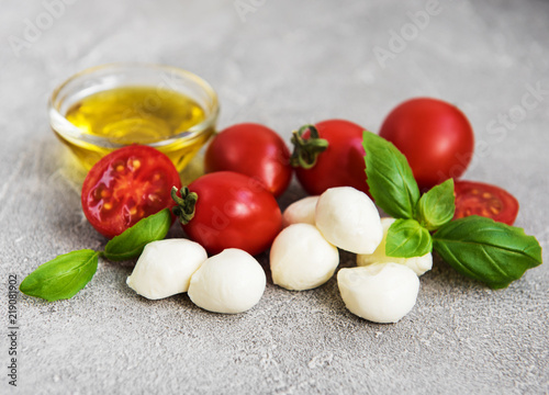 Italian food ingredients - mozzarella, basil, tomatoes