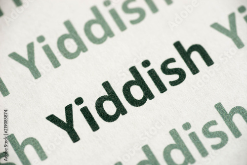 word Yiddish language printed on paper macro