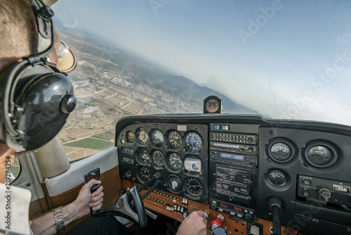 Pilot flying light aircraft.