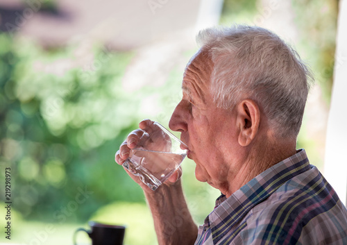 Old man drinking water