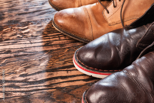 Stylish mens shoes on a wooden background
