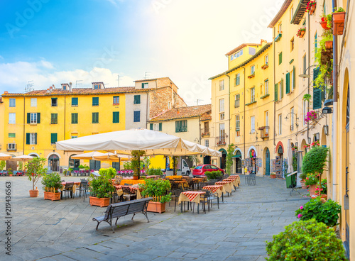 Cafe in the cozy morning lighted square of the city side. Italy. Europe