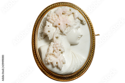 Gold vintage brooch with a woman's face in profile
