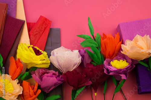 making crepe paper flowers on pink background