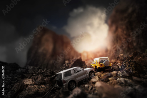 Four by four off road car crossing through the country road. Travel and racing concept for four wheel drive off road vehicle .