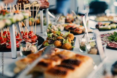 Table full of tasty food beautifully decorated.