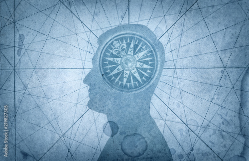 Human head and compass. The concept on the topic of navigation, psychology, morality, etc.