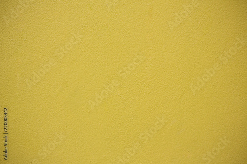 Yellow Concrete Wall Background.Concrete wall yellow color for texture background.Mustard rough concrete wall surface.