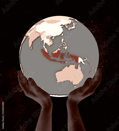 Indonesia on globe in hands