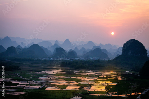 Sunset over rice paddy in rural Yangshuo China