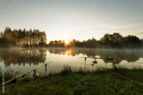 Carp fishing rods misty lake.