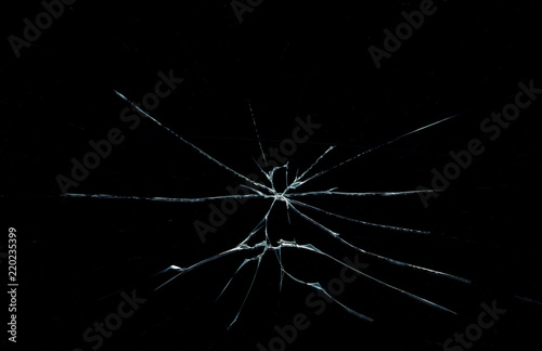 cracks on the glass on a black background