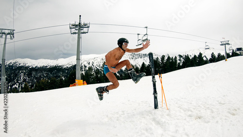 Happy Nude Male Have Fun Jump and Dance at Day Ski Slope Music Party