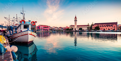Picturesque spring sunset in the Zakynthos city. Great evening view of the town hall and Saint Dionysios Church, Ionian Sea, Zakynthos island, Greece, Europe. Traveling concept background.