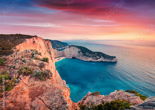 Dramatic spring scene on the Shipwreck Beach. Colorful sunset on the Ionian Sea, Zakinthos island, Greece, Europe. Beauty of nature concept background. Artistic style post processed photo.