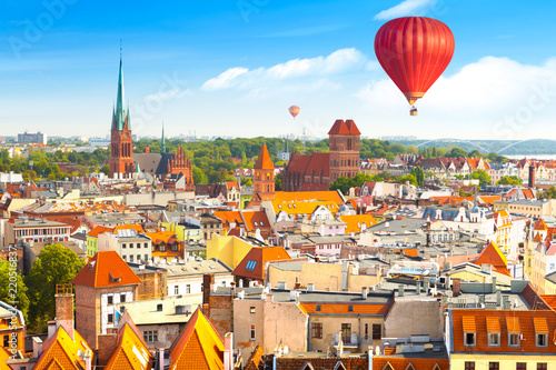 Aerial panoramic view of historical buildings and roofs in Polish medieval town Torun