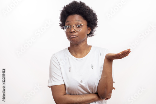 afro woman cannot understand something. isolated white background. misunderstanding, lack of understanding, incomprehension concept