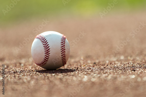 new baseball ball on red track rubber