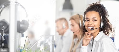 Call center worker accompanied by her team.