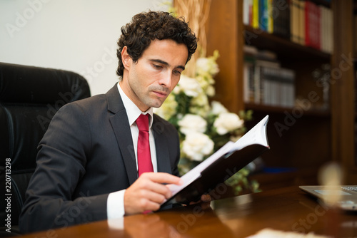 Businessman reading his agenda