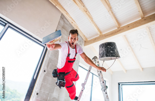 An accident of a man worker at the construction site.