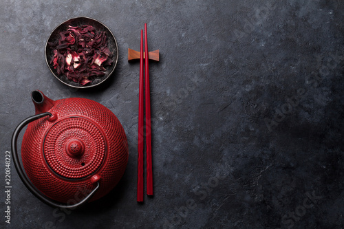 Red tea pot and sushi chopsticks