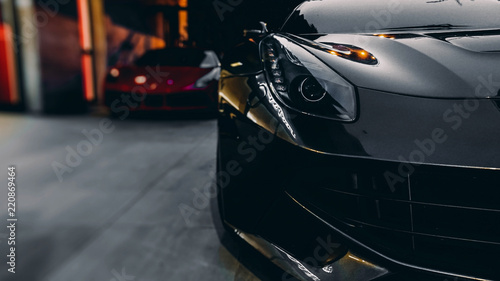 Front of a sports car - black and red car