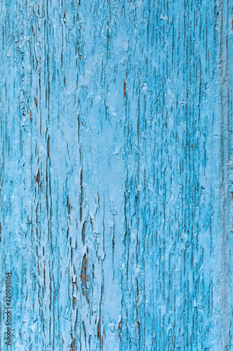 blue faded cracked paint texture. weathered peeled wooden surface
