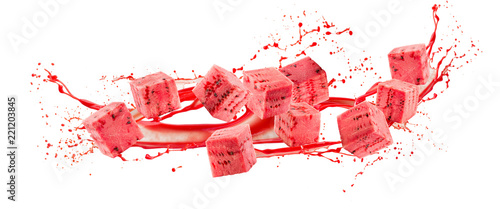 watermelon cubes in juice splash isolated on a white background