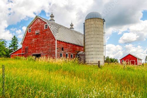 An Old Barn and Silo Stand Tall on a Hill in Minnesota