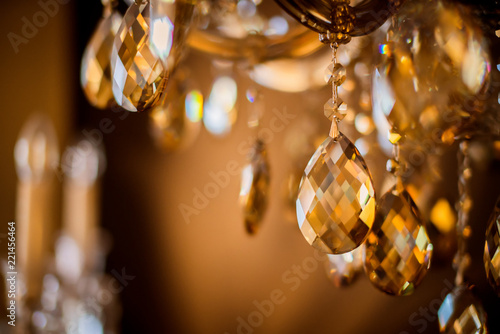 abstract image background of blur bokeh and crystal chandelier light equipment filter tone color effect