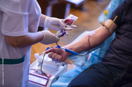 Blood donation hand. Nurse hands