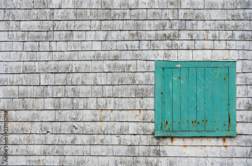 Gray Shingle Wall with Teal Door