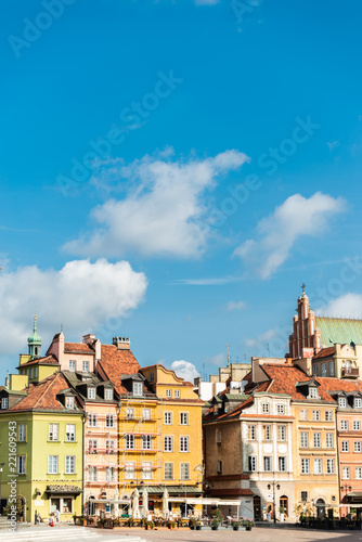Warsaw / Poland - August 20 of 2018 : Central square with colorful houses in Warsaw city. European architecture of old town in Poland. Concept of travel and city landscape.