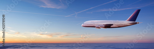 Huge two-storey passengers airplane flying above clouds