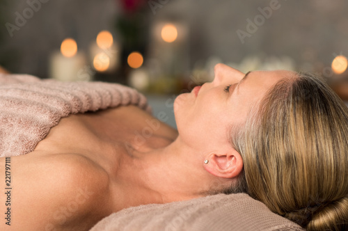 Mature woman relaxing at spa