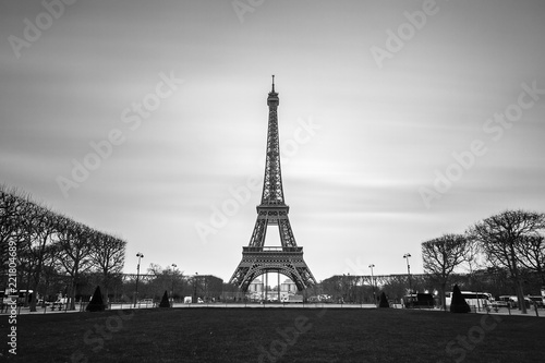 Beautiful tranquil long exposure view of the Eiffel tower in Paris, France, in black and white