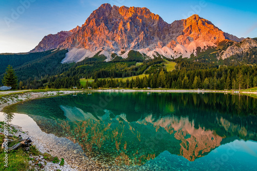 A beautiful view on the Ehrwalder Almsee and the Zugspitze on a sunny summer day in Austria, September 2018