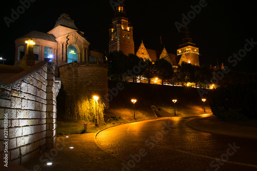 castle at night illuminated by lights in szczecin poland