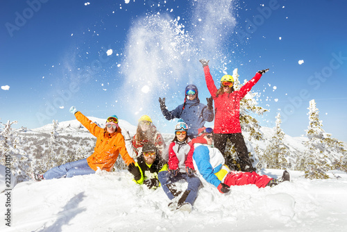 Happy skiers and snowboarders winter vacations