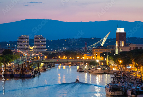 Pescara (Italy) - The view in the dusk from Ponte del Mare monumental bridge in the canal and port of Pescara city, Abruzzo region.