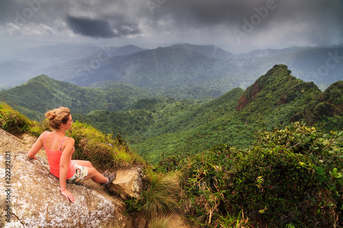 Adventurous young woman on top of the beautiful jungle of the El Yunque national forest in Puerto Rico