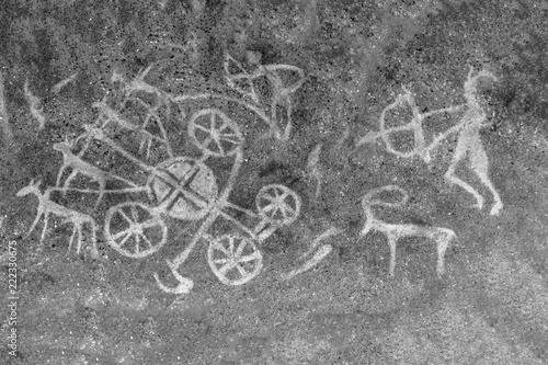 An image of an ancient hunt on a cave wall. ancient people. era, era. archeology.
