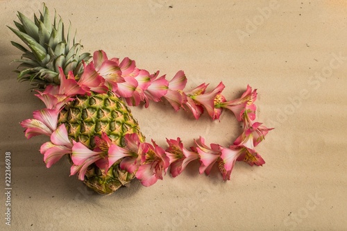 Hawaiian pineapple and fresh pink flower lei