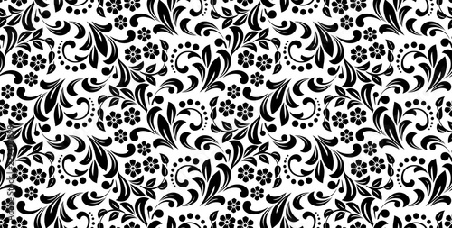 Flower pattern. Seamless white and black ornament. Graphic vector background. Ornament for fabric, wallpaper, packaging
