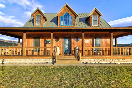 Nice wooden ranch home with beautiful landscape in the countryside.