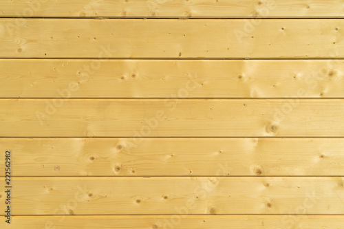 Photo wall of a wooden house made of wooden beams.