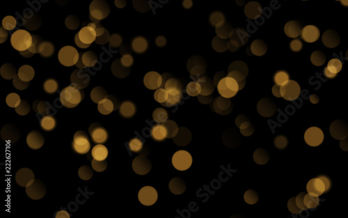 Abstract golden shining bokeh isolated on black background. Decoration or christmas background.